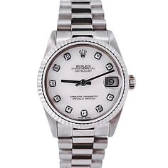 Women's Midsize Rolex 31mm DateJust 18K White Gold Watch with Pink Diamond Dial and Fluted Bezel. Pre-Owned SN# N11**** Brand: Rolex. Gender: Ladies. Dial Color: Pink. Crystal: Sapphire. Dial: Diamond Dial. Model Number: 68279. Bracelet / Strap: Jubilee. Metal Type: 18K White Gold. Case Dimensions: Midsize 31mm. Movement: Self-Winding (Automatic). Box / Certificate: Rolex Box / Certificate of Authenticity. Service Warranty: One (1) Year Limited Service Warranty. Rolex 31mm Datejust, Corum Watches, White Gold Watch, Chopard Watch, Zenith Watches, Rolex Watches Women, Hublot Watches, Chanel Watch, Rolex Women