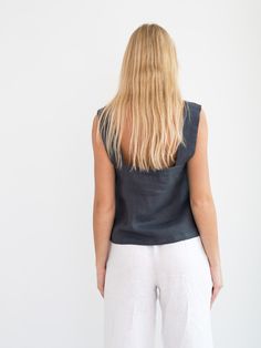 "BEA is a sleeveless, loose fitting linen tank top. DETAILS - Wide straps - Square neckline - Sleeveless design - 100% lightweight European linen fabric - Cut and sewn to order just for you in our studio COLOR - Dark Grey, you can also choose other colors above - Fabric samples are available here https://www.etsy.com/listing/586569696/linen-fabric-samples SIZING & FIT - Fits true to size - Length (shoulder to hem) is approximately 20 inches / 51 cm - Bust (pit to pit) is approximately inches Sleeveless Linen Tank Top For Beach, Summer Linen Sleeveless Tank Top, Summer Sleeveless Linen Tank Top, Sleeveless Linen Camisole For Beach, Sleeveless Linen Tops For The Beach, Sleeveless Linen Blouse For Beach, Sleeveless Linen Blouse For The Beach, Summer Linen Sleeveless Camisole, Beach Sleeveless Linen Tank Top