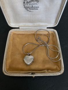 Beautiful 1970s VINTAGE SILVER Locket on a sterling silver 16 inch Chain. A lovely heart shaped Sterling Silver Engraved Pendant Necklace. 70s Vintage Silver Jewelry offered by Isobel Vintage Jewels on Etsy Style: Vintage 1970s real silver locket. A lovely heart 70s side opening sterling silver locket big enough for putting little photos inside.  Colour: silver  Size: 1.5 x 1.5 cm and 16 inch chain Condition: Excellent condition Approximate Date: 1970s Check out my other lovely silver items including this one: https://www.etsy.com/uk/listing/1269638336/70s-sterling-silver-ring-pretty-delicate Please note: ALL the items in my shop are vintage and have been previously worn. Items will show wear commensurate with their age and any major flaws will be noted and I really only sell items that ar Vintage Charm Heart Pendant Necklace For Anniversary, Anniversary Necklace With Vintage Charm And Heart Pendant, Vintage Necklace With Heart Charm As Gift, Vintage Necklace With Heart Charm, Vintage Heart Charm Necklace As Gift, Vintage Necklace With Heart Charm For Gift, Vintage Heart Charm Necklace For Valentine's Day, Vintage Necklace For Valentine's Day, Vintage Double Heart Charm Necklaces