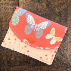 BUTTERFLIES Mini Wallet from TWO CHICKS SEW ----------------------------------------------------- MINI WALLETS are perfect for when you need to carry a few cards, your ID, and cash.   ~ 2-pocket design  ~ Secure snap closure ~ Fits in your pocket or a small purse. ~ 100% cotton fabric lined with interfacing for extra durability.  Measures approx. 4.25"wide X 3.25" tall ** ADD A CLIP ** ~ 1/2" silver metal lobster clasp ~ Attaches to your key ring, purse, or belt loop. ------------------------------------------------- ~ Mini Wallets are made by hand in our smoke-free home studio. ~ Pattern placement may vary from listing photos. ~ Colors may appear slightly different depending on your screen settings. ** If we have any questions about your order, we will message you over Etsy. A delay in yo Cute Bifold Wallets For Everyday Use, Cute Bifold Wallet For Everyday Use, Cute Everyday Bifold Wallet, Cute Red Wallets For Everyday Use, Cute Handmade Wallets For Everyday Use, Cute Handmade Wallets For Everyday, Wallet Minimalist, Fabric Wallet, Travel Wallet