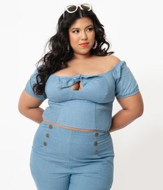 Fresh femininity, dames! This sultry plus size top from Unique Vintage is crafted in a sturdy woven fabric that radiates rockabilly vibes in chambray blue. The Turner Top boasts a self tie bow for added retro flair while the stunning off the shoulder and Bardot sleeves lends eye-catching detail to your posing. Outfitted with a smocked back and elastic cuffs for a flattering fit!Available in sizes XS-5X while supplies last. Vintage Plus Size, 1970s Fashion, Tie Bow, Plus Size Top, Woven Top, Vintage Branding, Model Pictures, Pocket Dress, Chambray