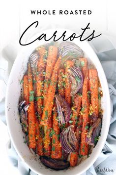 a white bowl filled with carrots on top of a table