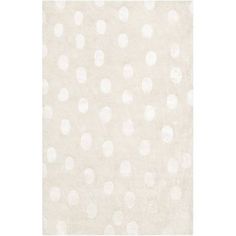 an area rug with white polka dots on it