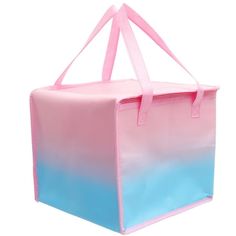 a pink and blue tote bag on a white background