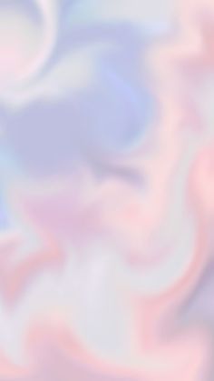 a blurry image of pink, blue and white swirls in the air on a soft background