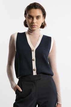 Wool Blend Cozy Knit Vest Cozy Sweater Vest For Winter Workwear, Cozy Chunky Knit Workwear Tops, Cozy Chunky Knit Tops For Work, Fall Workwear Knitted Sweater Vest, Chic Soft Knit Sweater Vest For Winter, Winter Textured Knit Sweater Vest For Workwear, Chic Chunky Knit Sweater Vest For Winter, Casual Fine Knit Sweater Vest For Fall, Chic Wool Knitted Tops