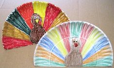 two paper plates with turkeys on them, one painted like a peacock and the other as a dog