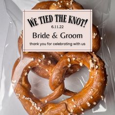 two pretzels are wrapped in plastic and the label says, we tied the knot