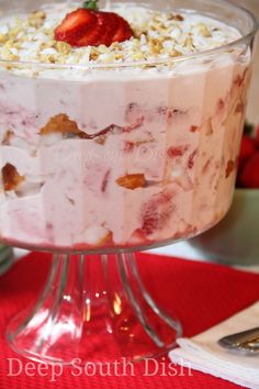 a trifle with strawberries and cream on top