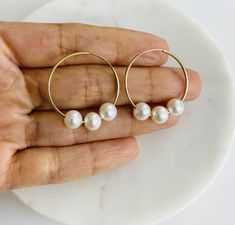 10K Solid Gold 6-7mm white semi-round freshwater cultured pearl endless hoop earrings  SIZE:   Outer diameter: 25mm Inner diameter: 24mm  Hoop thickness: 0.9mm Sold as a pair  REAL FRESHWATER PEARL REAL 10K GOLD NOT( PLATED OR FILLED)....  10k Stamped for Authenticity  Nickel and Lead Free... Hypoallergenic. FREE GIFT BOX Nickel-free White Hoop Earrings For Anniversary, Adjustable White Hoop Earrings For Anniversary, White Pearl Hypoallergenic Hoop Earrings, White Hoop Earrings For Anniversary, Hypoallergenic White Pearl Hoop Earrings, White Minimalist Round Hoop Earrings, White Hypoallergenic Small Hoop Earrings, Minimalist White Round Hoop Earrings, White Pearl Round Hoop Earrings