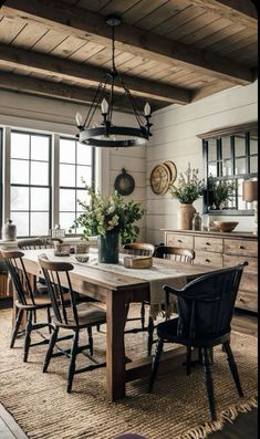 the dining room table is surrounded by chairs