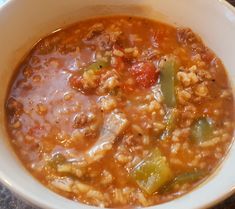 a white bowl filled with soup on top of a table