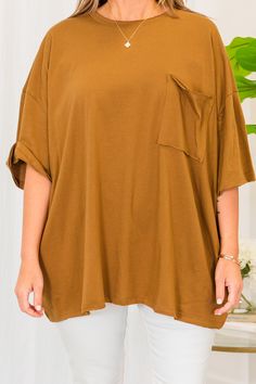 Embrace comfort and style effortlessly with this top! This deep camel versatile top is perfect for a casual day out on the town, and can be easily paired with skinnies or leggings! The raw hemlines adds a touch of uniqueness to your look! Get ready to feel comfortable and confident in this top! 100% Cotton Oversized Brown Summer Tops, Plain Brown Tops For Fall, Plain Brown Summer Tops, Casual Camel Tops For Spring, Versatile Stretch Brown Top, Brown Relaxed Fit Top, Trendy Solid Brown Tops, Stretch Brown Tops For Day Out, Oversized Plain Top For Layering