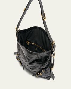 Givenchy "Voyou" slouchy shoulder bag in calfskin leather    Adjustable shoulder strap    Top zip closure    Can be worn as a shoulder bag or crossbody    Interior, one main compartment and one zip pocket    Approx. 10.6"H x 15.7"W x 2.5"D    Lining: Acrylic/cotton    Made in Italy Luxury Leather Crossbody Backpack, Everyday Luxury Leather Satchel Shoulder Bag, Luxury Hobo Crossbody Bag With Removable Pouch, Luxury Soft Leather Crossbody Backpack, Everyday Luxury Leather Crossbody Shoulder Bag, Leather Crossbody Shoulder Bag For Everyday Luxury, Luxury Leather Bucket Bag With Zipper Closure, Designer Textured Leather Shoulder Bag For Everyday Use, Everyday Luxury Textured Leather Tote Shoulder Bag