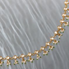 Introducing our exquisite collection of Zuri Moissanite anklets, handcrafted by skilled artisans with the finest materials. Our anklets are a true reflection of India's rich cultural heritage and traditional craftsmanship. Each anklet is designed to add a touch of elegance and charm to any outfit. From delicate chains adorned with intricate charms to bold statement pieces with vibrant beads, our collection offers a wide range of styles to suit your taste and personality. India Inspired, Green Bead, Gold Material, Statement Pieces, Anklets, Semi Precious, 925 Silver, Silver Jewelry, Chain