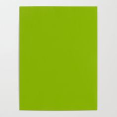 a bright green piece of paper on a white surface