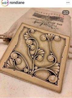 a wooden stamp with an ornate design on it's side and the words, i love