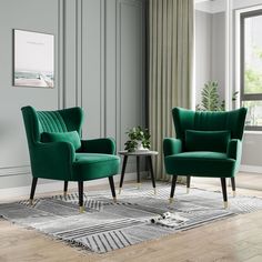 a living room with two green chairs and a rug