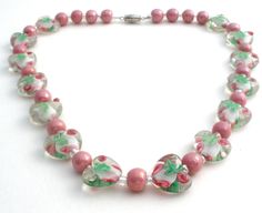 Vintage Jewelry - This is a Venetian pink, green and clear murano lampwork glass bead necklaces with heart shape beads and tiny roses and leaves. The necklace is 18" long and .88" wide. Glass Bead Necklaces, Fish Necklace, Rose Heart, Rosé Heart, Bead Necklaces, Ring Watch, Watch Chain, Lampwork Glass Beads, Glass Bead Necklace