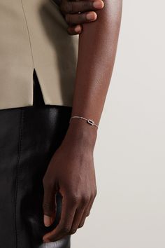 Messika's jewelry has been worn on the red carpet by everyone from Beyoncé to Margot Robbie. This 'Move Uno' bracelet is handcrafted from 18-karat white gold and centered with a twinkling pavé-set charm - the single diamond at the center glides freely. It's anchored by a dainty chain, so it'll stack nicely with other styles. Designer White Gold Bracelets With Single Cut Diamonds, Modern Formal Bracelet With Baguette Diamonds, Modern Formal Bracelets With Baguette Diamonds, Designer White Gold Diamond Bracelet For Formal Events, Designer White Gold Diamond Bracelet For Formal Occasions, Minimalist Baguette Diamond Bracelets For Formal Occasions, Minimalist Formal Bracelets With Baguette Diamonds, Designer Diamond Bracelets In White Gold, Designer White Gold Diamond Bracelet With 17 Jewels