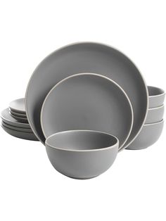 the grey dishes are stacked on top of each other