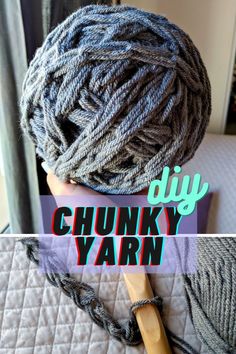 a skein of chunk yarn sitting on top of a bed next to a crochet hook