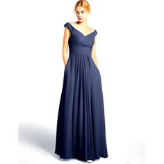 a woman in a long blue dress is standing with her hands on her hips and looking off to the side