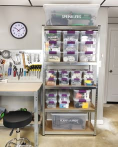 a workbench with lots of tools and supplies on the shelves next to it