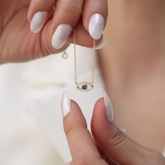 The Sapphire Evil Eye Necklace in 14K solid gold combines elegance with symbolism. Featuring a vibrant sapphire and the protective Evil Eye motif, it's both a stylish accessory and a talisman of good fortune, ideal for everyday wear or special occasions. Crafted for durability and beauty, it symbolizes protection and positivity, making it a meaningful addition to any jewelry collection. FEATURES Sapphire Carat: 0.20ct  Color: Dark Blue Cut: Excellent Dimensions:  3x3 1 Pcs Material: 14K Solid Go 14k Gold Evil Eye Jewelry Gift, Symbolic Gemstone Jewelry For Formal Occasions, Elegant Evil Eye Jewelry For Anniversary, Sapphire Birthstone Gold Plated Jewelry, Gold Plated Sapphire Birthstone Jewelry, Symbolic 14k Gold Gemstone Jewelry, Symbolic Yellow Gold Jewelry With Birthstone, Yellow Gold Evil Eye Jewelry For Anniversary, Gold Sapphire Gemstone Jewelry