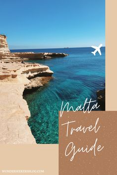 an airplane is flying over the water near some rocky cliffs and blue waters with text that reads