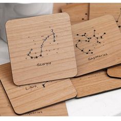 wooden coasters with zodiac signs on them