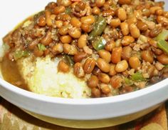 a white bowl filled with beans and rice