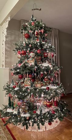 a christmas tree with ornaments and lights on it