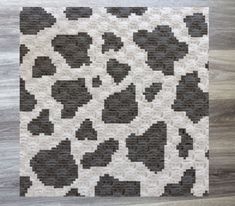 a black and white rug with hearts on it