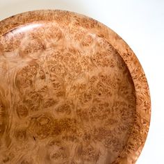 a large wooden plate sitting on top of a table