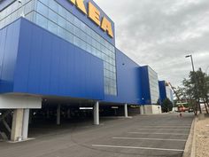 an empty parking lot in front of a ikea store