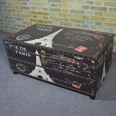 an old trunk with the eiffel tower painted on it's side and writing all over it