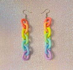 If pastels are your vibe, then these pastel rainbow earrings are the perfect wear! Match these vibrant earrings with any outfit and are just OOAK. Check out our earrings section for more unique designs❤️. *Stainless steel earring hooks *1.5 inches long  If you have any questions, please don't hesitate to ask! We are friendly:) Visit our official website: www.theyeetboutique.com and follow us on Instagram: @theyeetboutiquee Cute Rainbow Dangle Earrings, Cute Rainbow Jewelry For Pierced Ears, Multicolor Dangle Earrings In Kawaii Style, Kawaii Multicolor Dangle Earrings, Trendy Rainbow Hypoallergenic Jewelry, Kawaii Multicolor Party Jewelry, Trendy Hypoallergenic Rainbow Jewelry, Trendy Rainbow Dangle Jewelry, Cute Rainbow Hypoallergenic Earrings