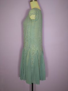 "Beautiful 1920s silk chiffon beaded dress in a light blue color. Has a scoop neckline, cap sleeves, and flutter skirt which is created by diamond shaped beaded and rhinestone vertical embellishments. Condition: very good vintage condition. Has one tiny mend where there is an intersection of two diamonds. Has a small stain on the bodice and at the armpits which I have not attempted to clean Quite minor. Label: none Circa: 1920s Composition: silk Color: blue Size: small Measurements: Shoulder str Draping Dress, Deco Beads, Dresses 40s, Beaded Chiffon, 1920s Dress, 1920s Art, 1940s Dresses, 1920s Art Deco, Diamond Shaped