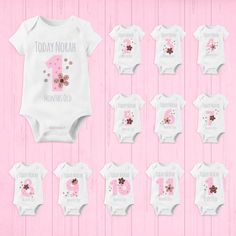 A personalised baby grow design in pink with a number is a cute and unique way to celebrate your little one's age or special occasion. The baby grow is made from soft and comfortable cotton material, perfect for your baby's delicate skin. The design features a large pink number prominently displayed on the front of the baby grow, in a stylish and eye-catching font. The number can be personalised to match your little one's age or the milestone you want to celebrate, such as their first birthday o Pink Onesie With Letter Print For First Birthday, Pink Letter Print Onesie For Gender Reveal, Customizable Cute Birthday Bodysuit, Customizable Cute Bodysuit For Birthday, White Personalized Bodysuit For First Birthday, Personalized White Bodysuit For First Birthday, Cute Personalized Onesie For Birthday, Personalized Pink Onesie For Birthday, Birthday Bodysuit With Name Print And Short Sleeves