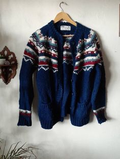 "Womens M Viking Iceland Icelandic Style Button Up Wool Chunky Knit Vintage Cardigan Sweater. Features a traditional Fair Isle design.  It is a great color combination of Navy Blue, Maroon & White. 100% Pure New Wool. Tag Size Medium. Actual Measurements are as follows: Chest 40\" Length 26.5\" Condition: Excellent! No holes or stains and will be sweater shaved and Pilling free so it will be ready to wear!! Ships USPS Priority Packages. Combined shipping is available. *Any additional items shown Cozy Blue Knitted Sweater Coat, Cozy Blue Crew Neck Cardigan, Blue Wool Winter Cardigan, Blue Wool Cardigan For Winter, Blue Wool Long Sleeve Cardigan, Vintage Chunky Knit Cardigan For Fall, Cozy Blue Cardigan With Buttons, Blue Cozy Cardigan With Buttons, Blue Wool Knitted Cardigan