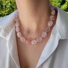 Raw rose quartz crystal necklace. Chunky statement natural gemstone beaded necklace for women. Large light pink handmade necklace with big bead and gemstone. Big bold bohemian bright necklace in gold color are suitable for an casual look, evening look and for a holiday. These necklace will be a good Christmas, anniversary, wedding or birthday gift for women, mom, wife, girlfriend, sister or daughter. Women's necklace with natural stone. It emphasizes the beauty of your neck and adds charm to you Pink Rose Quartz Crystal Necklace With Natural Stones, Elegant Rose Quartz Round Beads Crystal Necklace, Elegant Rose Quartz Crystal Necklace With Round Beads, Rose Quartz Crystal Necklace With Gemstone Beads, Rose Quartz Crystal Necklace With Round Gemstone Beads, Rose Quartz Gemstone Beads Crystal Necklace, Rose Quartz Gemstone Beaded Necklace, Rose Quartz Crystal Necklaces For Jewelry Making, Rose Quartz Beaded Necklaces For Gift