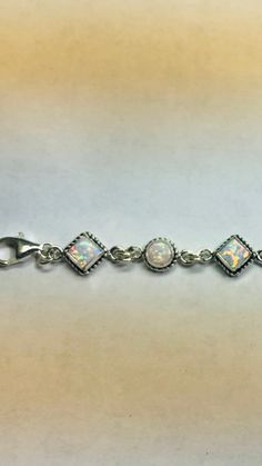 *Bracelet size is 8 inches long including extensions *Jewelry send out In Gift box *Sterling silver bracelet .925 *lab created opal *Handmade in Albuquerque NM.USA *Cabochons color may vary *Ship out within 48 hours guarantee on business days. Thank You For Your Looking ,And Check Out More Items In My Etsy Shop For More Great Deals, Also We Add More Jewelry To Etsy Shop Regularly https://www.etsy.com/shop/ABQdesign White Sterling Silver Jubilee Bracelet Gift, Classic Sterling Silver Jewelry With Extender, Adjustable Sterling Silver Bracelets With Extender, Classic White Adjustable Charm Bracelet, Adjustable White Bracelet With Sterling Silver Clasp, Classic Adjustable White Charm Bracelet, Classic Sterling Silver Bracelet With Extender As Gift, White Jewelry With Extender As A Gift, White Sterling Silver Bracelet As Gift