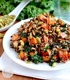 a white plate topped with rice and vegetables