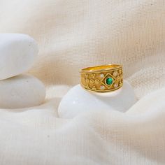 Handmade with the ancient technique of granulation this ring can make every look more elegant. 100% handmade in our workshop. Metal: 14K Gold | 18K Gold Gemstones: Emerald | weight 0,17 ct Diamonds | weight 0,06 ct You can choose any gemstone of your choice to decorate the jewelry that you want. Do not hesitate to contact us. Sizing details: For your convenience you can use this website to find your ring size: https://findmyringsize.com/ If you can we recommend to visit your local jewelry shop t Green Byzantine Style Round Jewelry, Byzantine Yellow Gold Emerald Ring For Anniversary, Byzantine Style Yellow Gold Emerald Ring For Anniversary, Byzantine Style Emerald Ring In Yellow Gold, Byzantine Gold Emerald Ring For Anniversary, Byzantine Gold Emerald Anniversary Ring, Byzantine Style Emerald Ring For Gift, Byzantine Style Gemstone Wedding Ring, Byzantine Ring