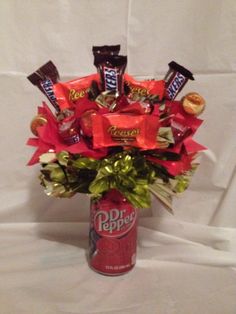 a bouquet of candy and candies in a can