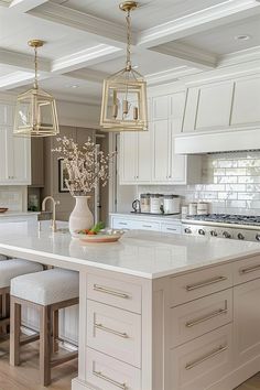 a kitchen with white cabinets and an island in the middle is surrounded by stools