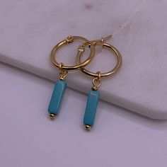 Materials: Stainless steel gold-plated hoop earrings, Turquoise Magnesite. Sizing + Fit: 18mm hoops. Turquoise Metal Hoop Earrings, Turquoise Hoop Metal Jewelry, Turquoise Metal Hoop Jewelry, Modern Turquoise Hoop Earrings, Nickel-free Turquoise Metal Hoop Earrings, Small Turquoise Nickel-free Hoop Earrings, Small Nickel-free Turquoise Hoop Earrings, Blue Tarnish Resistant Hoop Earrings, Blue Tarnish-resistant Hoop Earrings