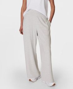 Our super comfortable trousers for everyday activities. Soft, sustainable fabric made from plant-based modal Lenzing™ yarn. Effortless pull on design and a relaxed wide leg fit. Wear high rise or with the wide waistband folded down. Two subtle slip pockets at the hips. Inseam length: 73cm / 23”. Model wears size S and is 178cm/5'10" tall. Style Code: SB8238BColour: Light Grey Marl Wide-leg Yoga Pants With Pockets For Loungewear, Versatile Wide Leg Pull-on Pants For Loungewear, Versatile Relaxed Fit Yoga Pants For Lounging, Relaxed Fit Wide Leg Pants With Pull-on Style, Solid Color Wide Leg Pants With Relaxed Fit, Comfortable Loose Fit Yoga Pants For Lounging, Relaxed Fit Wide Leg Bottoms With Comfort Waistband, Comfortable Relaxed Fit Pants With Elastic Waistband, Versatile Yoga Pants For Spring Loungewear