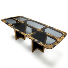 an artisticly designed coffee table with glass top